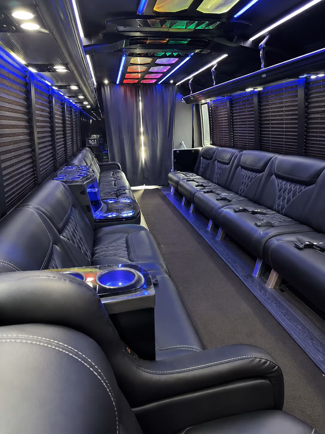 Friends laughing during a party bus celebration in El Paso
